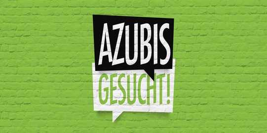 Green wall with sign "Azubis gesucht" (apprentices wanted)
