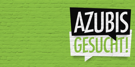 Azubis gesucht Grüne Mauer mit Schild "Azubis gesucht"