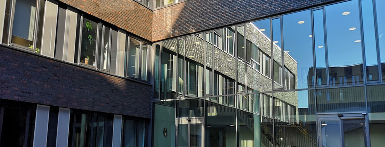 Reflections in the windows of the inner courtyard of the OH12