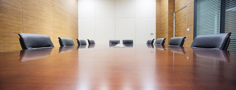 Conference table with empty chairs