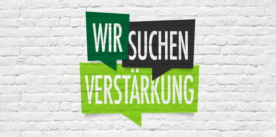 Reinforcement wanted White Wall with sign "Wir suchen Verstärkung" (We're looking for reinforcements)