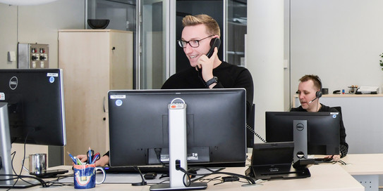 Two members of the Service Desk in consultation