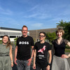 Olga Wagner, Uwe Wilkesmann, Sabine Lauer and Viktoria Jäger on the outside of the conference venue.