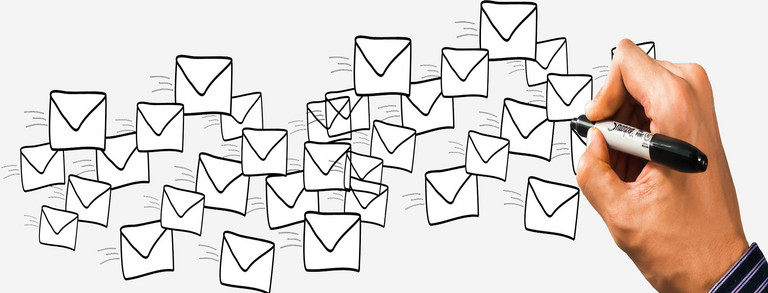 Hand draws envelopes with a pencil
