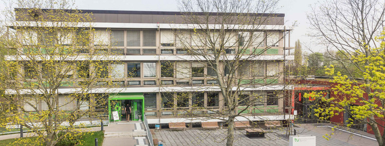 Student affairs office with trees in front of it.