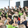 Students sitting in a lecture in the lecture hall.